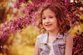 Happy girl portrait in blooming cherry garden Royalty Free Stock Photo