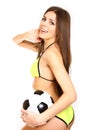 Happy girl posing with a soccer ball on a white background Royalty Free Stock Photo