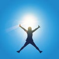 Happy girl with raised arms jumps at sunshine sunny blue sky