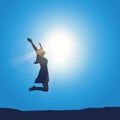 Happy girl with raised arms jumps at sunshine sunny blue sky