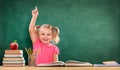 Happy Girl Raising Hand In The Classroom