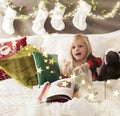 Christmas storytelling in bed Royalty Free Stock Photo