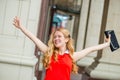 Happy girl in red dress with arms outstretched Royalty Free Stock Photo