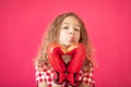 Happy girl with red heart shaped boxing gloves