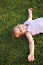 Happy girl relaxing on a grass Royalty Free Stock Photo