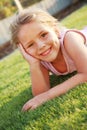 Happy girl relaxing on a grass Royalty Free Stock Photo