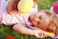 Happy girl relaxing on a grass Royalty Free Stock Photo