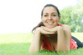 Happy girl relaxing on green grass Royalty Free Stock Photo