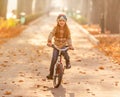 Happy girl riding bike in park Royalty Free Stock Photo