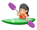 The happy girl is rowing the canoe with the long paddle