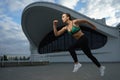 Happy girl run outdoor at modern urban area during sunset. Royalty Free Stock Photo