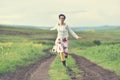 Happy girl running on a countryside road Royalty Free Stock Photo