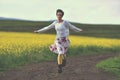 Happy girl running on a countryside road Royalty Free Stock Photo