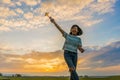 Happy girl running with a kite at sunset outdoors Royalty Free Stock Photo