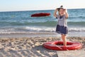 Happy girl in sailor hat on beach Royalty Free Stock Photo