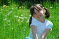 Happy girl sat in field