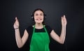 Happy girl seller listening music from her headphones Royalty Free Stock Photo