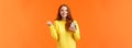 Happy girl share good news with you. Cheerful pretty redhead female holding smartphone, fist pump in triumph or Royalty Free Stock Photo