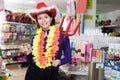 Happy girl shopper having fun in festival outfits store Royalty Free Stock Photo