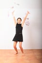 Happy girl - smiling kid standing in money rain Royalty Free Stock Photo