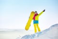 Happy girl snowboarder copyspace top mountain