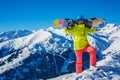 Girl snowboarder having fun in the winter ski resort. Royalty Free Stock Photo