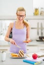 Happy girl spread toast with chocolate cream Royalty Free Stock Photo