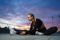 Happy girl stretch outdoor at modern urban area during sunset Royalty Free Stock Photo