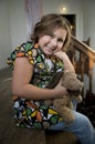 Happy girl with stuffed dog