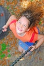 Happy girl on swing