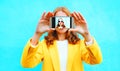 Happy girl takes a picture self portrait on smartphone Royalty Free Stock Photo