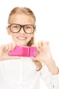 Happy girl taking picture with cell phone Royalty Free Stock Photo