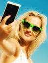 Happy girl taking self picture with smartphone Royalty Free Stock Photo