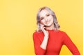 Happy girl talking phone isolated in the yellow background. Royalty Free Stock Photo