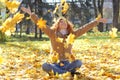 Happy girl throwing leaves Royalty Free Stock Photo