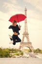 Happy girl travel in paris, france. Woman jump with fashion umbrella. Parisian isolated on white background. Woman with Royalty Free Stock Photo