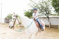 Happy Girl Undergoing Equine-Assisted Therapy Royalty Free Stock Photo