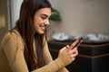 Happy girl using smartphone app enjoying online virtual chat video call with friends virtual meeting recording stories for social Royalty Free Stock Photo