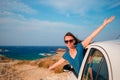 Happy girl on vacation travel by car. Summer holiday and car travel concept. Royalty Free Stock Photo