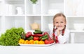 Happy girl with various vegetables