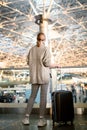 happy girl is waiting for departure at the airport Royalty Free Stock Photo