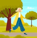 Happy girl is walking on street. Female character spends time outdoors in city park, summer weather