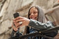 Happy girl watching internet social media in cell phone Royalty Free Stock Photo