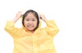 Happy girl is wearing yellow raincoat smile isolated Royalty Free Stock Photo