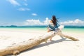 Happy girl on White sand beach and Long-tail boat at Khang Khao Island Bat island, The beautiful sea Ranong Province, Thailand Royalty Free Stock Photo