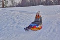 Happy girl on a winter sleigh ride Royalty Free Stock Photo