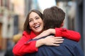 Happy girlfriend hugging her boyfriend after proposal