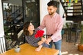 Happy girlfriend receiving a bouquet of flowers Royalty Free Stock Photo