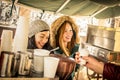 Happy girlfriends best friends having fun at coffee vendor Royalty Free Stock Photo