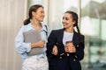 Happy girlfriends walking by street after school, have conversation Royalty Free Stock Photo